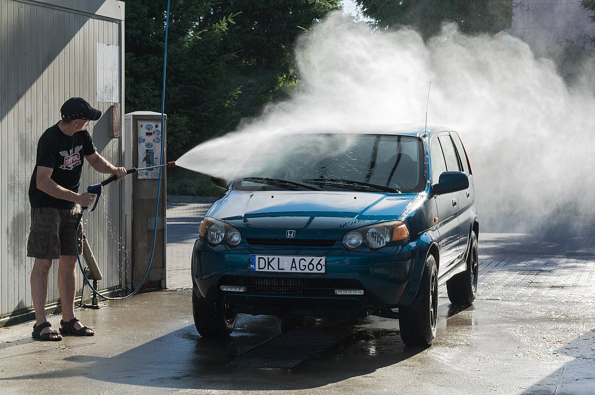 Person washing a car